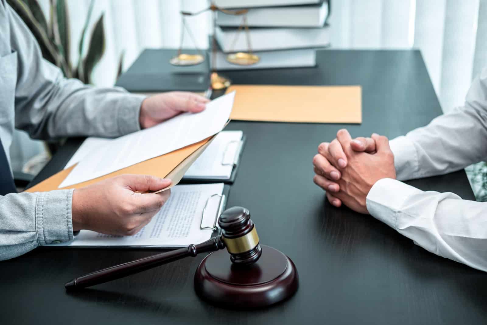 client discussing with a lawyer - business litigations lawyer
